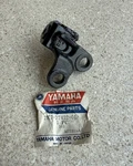 Nos Yamaha YZ250 (1976-1978) Right Footrest Footpeg Bracket 2K7-27422-01. Fixed Price $50.00.